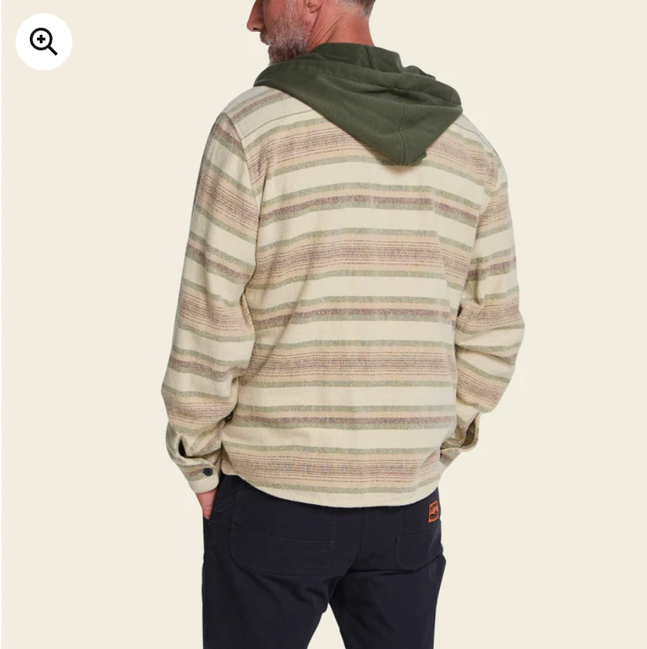 Man in a striped flannel hoodie with back facing