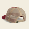Rear three-quarter view of a trucker cap with a beige mesh back and a dark red flat brim and top button, on a light cream background.