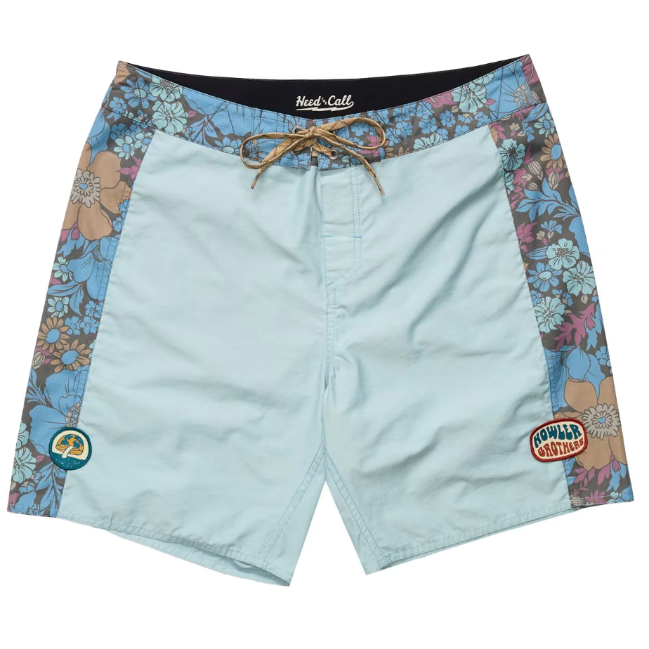 Light blue shorts with floral side panels and brand logos on a white background