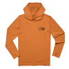 Orange hoodie with a logo on the chest against a beige background