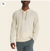 Man wearing a bone performance hoodie on a neutral background