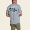 Man in a grey tshirt that reads Howler Bros and has shorses