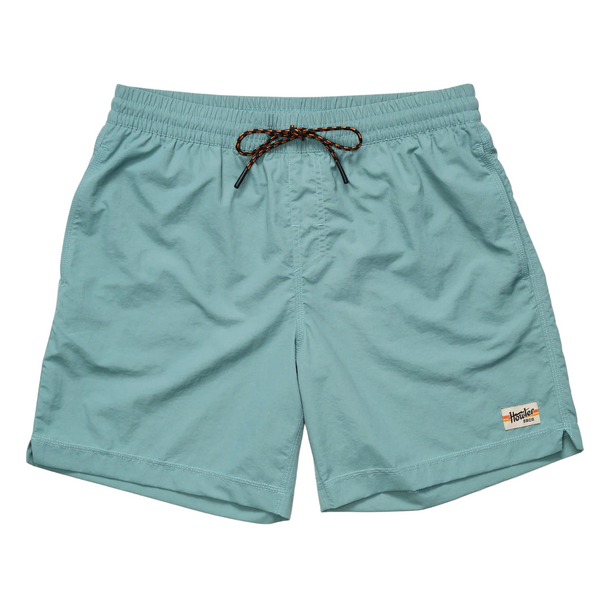 Light blue shorts with a drawstring on a beige background