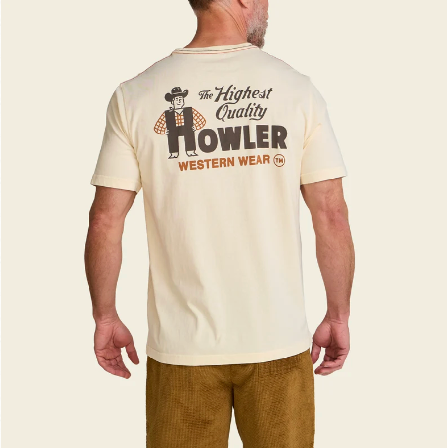 A man wearing a cream-colored t-shirt from the back, featuring a retro graphic of a cowboy and the text 'The Highest Quality HOWLER WESTERN WEAR'.