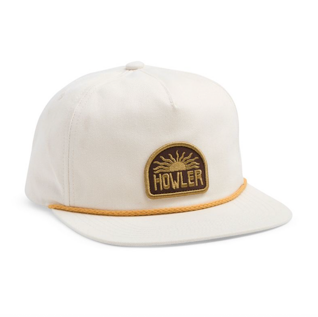 White cap with brown brim and Howler logo on a white background