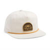 White cap with brown brim and Howler logo on a white background