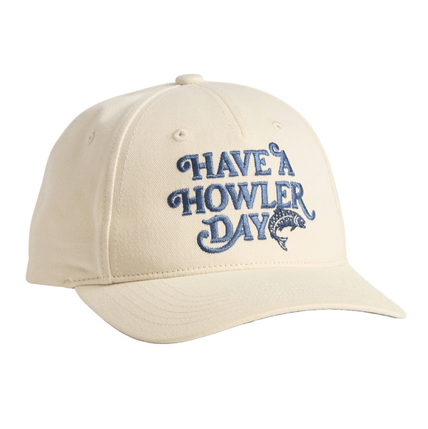 Beige cap with blue text 'Have a Howler Day' on a light beige background