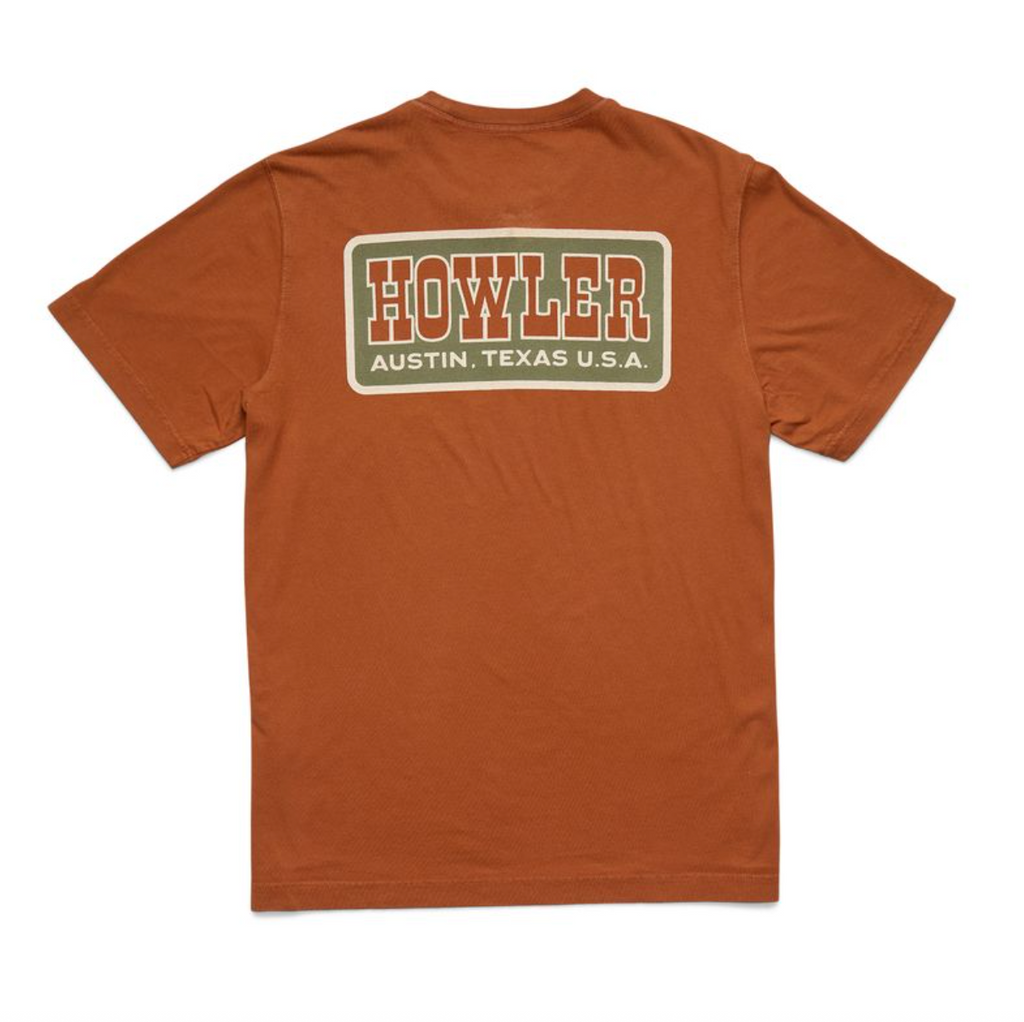 Brown t-shirt with 'Howler' logo on the back against a white background