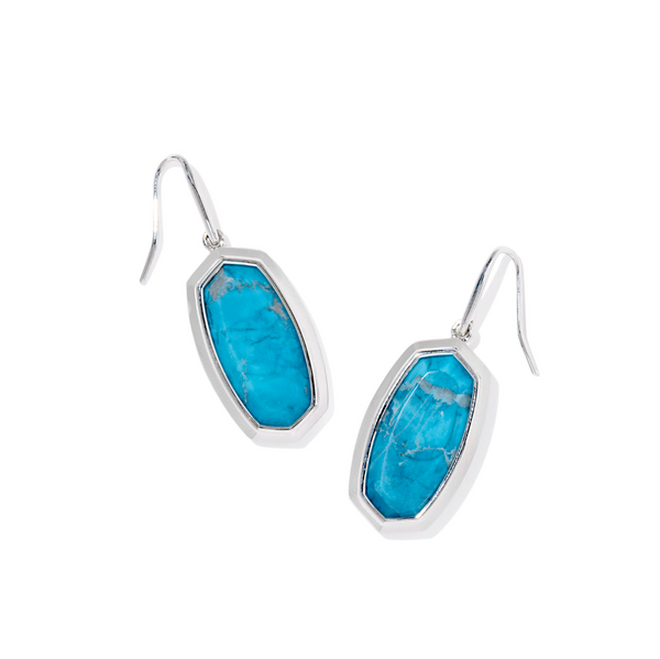 Turquoise stone earrings with silver frames on a white background