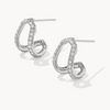 Pair of silver hoop earrings with clear gemstones on a white background
