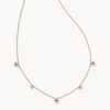 Silver necklace with heart-shaped pendants on a white background