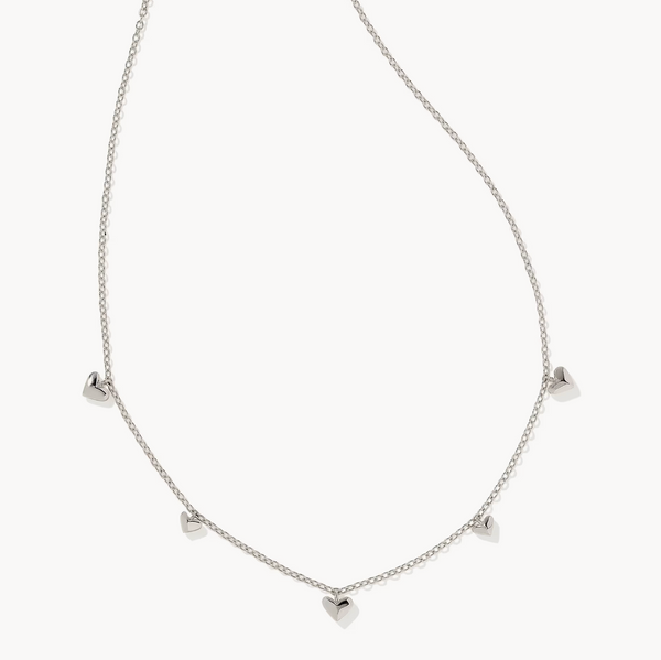 Silver necklace with heart-shaped pendants on a white background