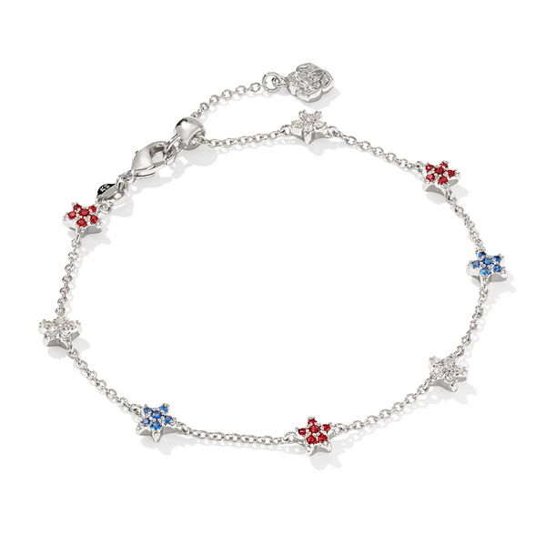 A gold-colored chain bracelet featuring red, white, and blue star-shaped crystals.