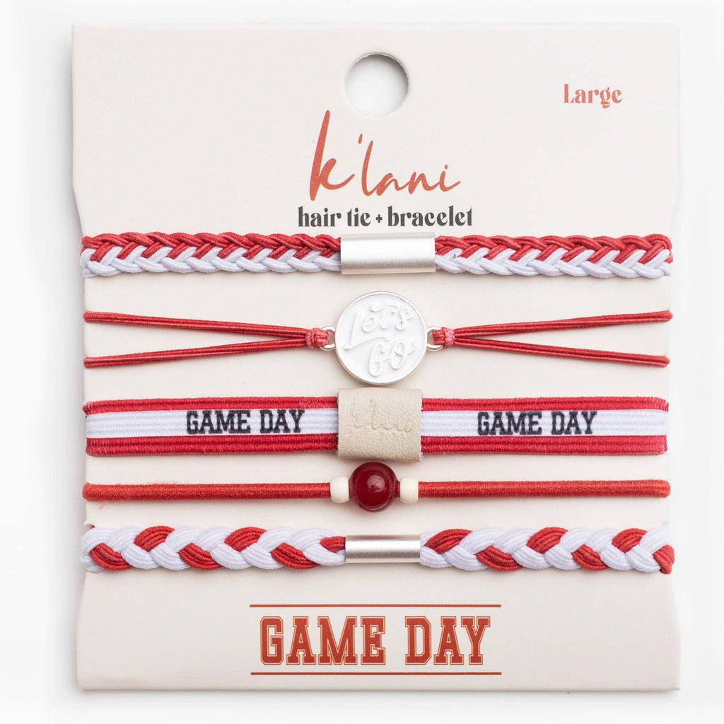 Set of red and white hair ties and bracelets on a 'Klani ' branded card.