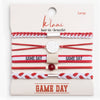 Set of red and white hair ties and bracelets on a 'Klani ' branded card.