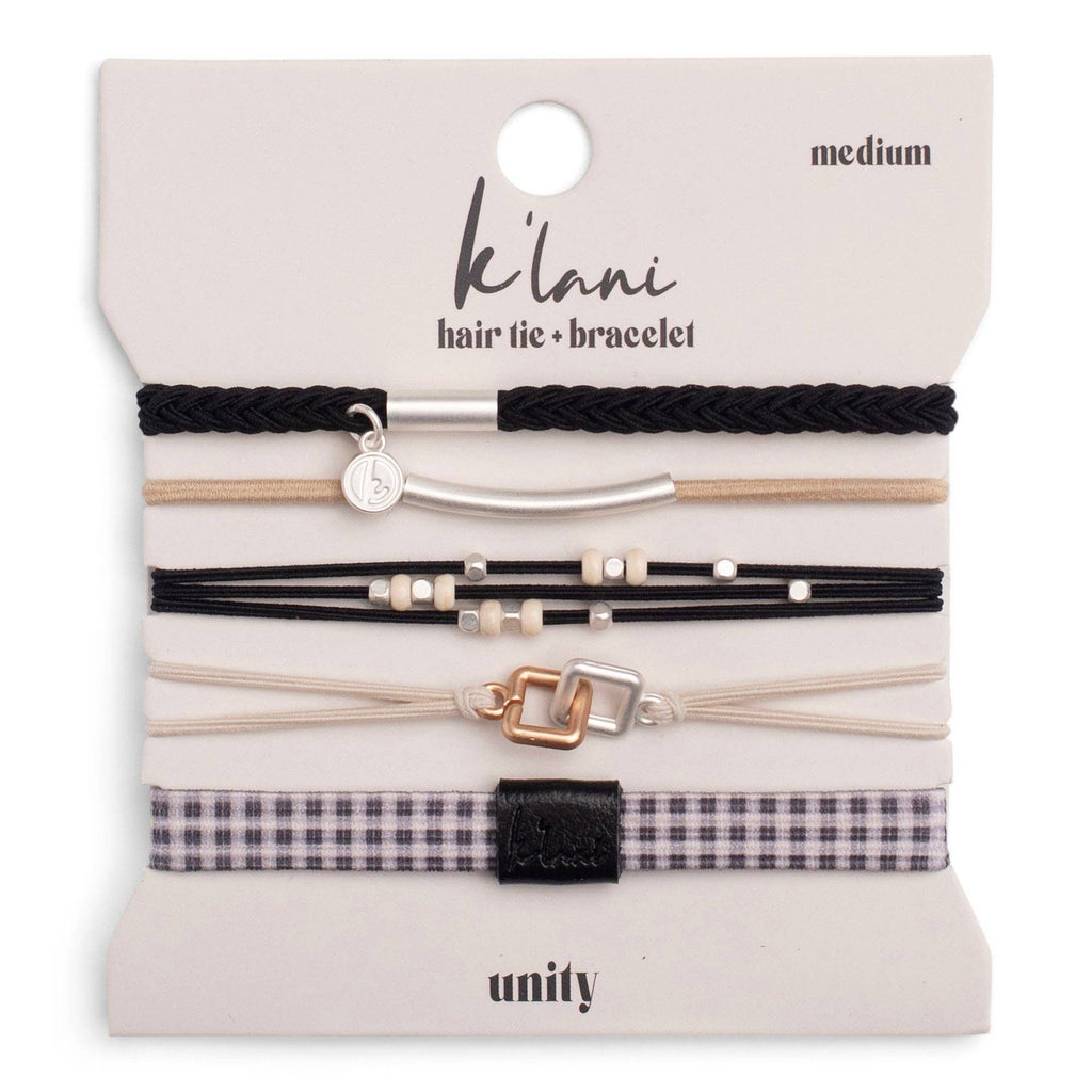 Set of hair ties and bracelets on a 'klani' branded card with 'unity' text.