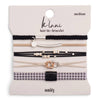 Set of hair ties and bracelets on a 'klani' branded card with 'unity' text.