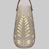 Decorative lantern with cut-out patterns on a gray background