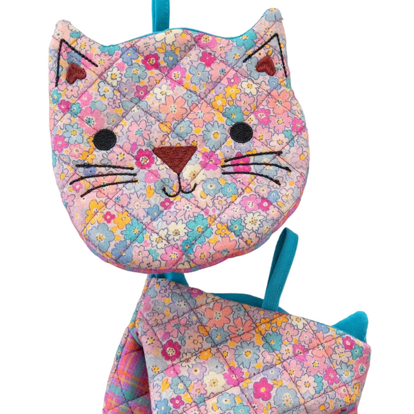 Floral-patterned cat-shaped backpack on a white background