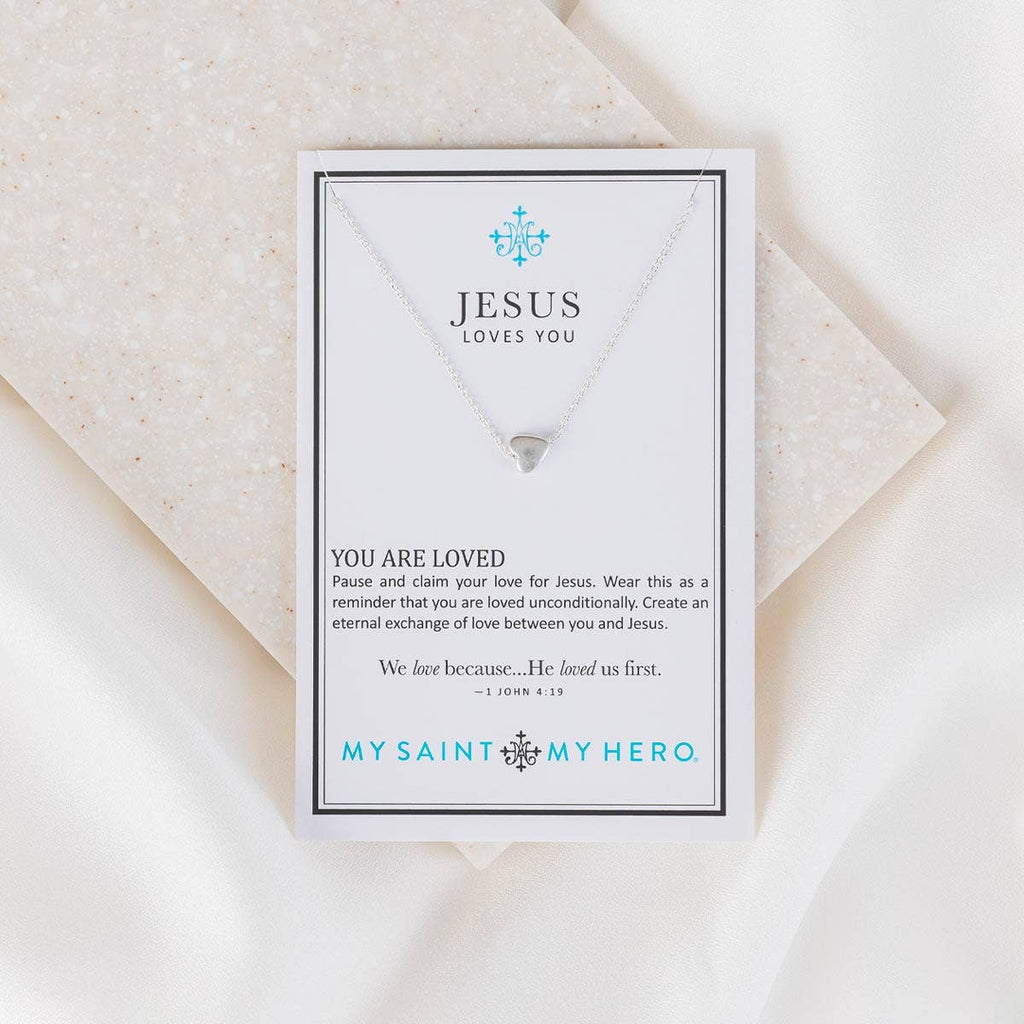 Necklace card with 'Jesus Loves You' message on a white background
