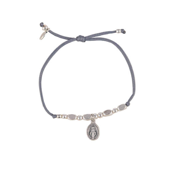 Bracelet with a central charm on a white background
