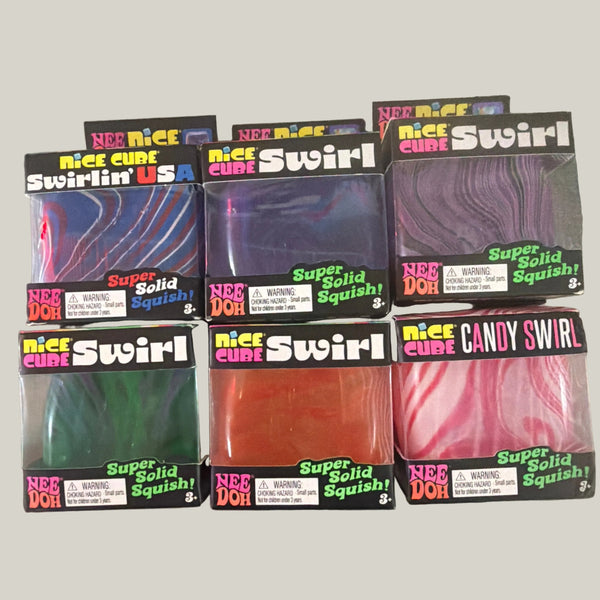 Six boxes of Nee Doh Swirlin' USA candy squishies arranged in two rows on a rustic wooden table. The boxes contain various colorful, swirled gel candies, including purple, green, orange, and pink varieties.