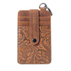 Brown leather card case with embossed design on a white background