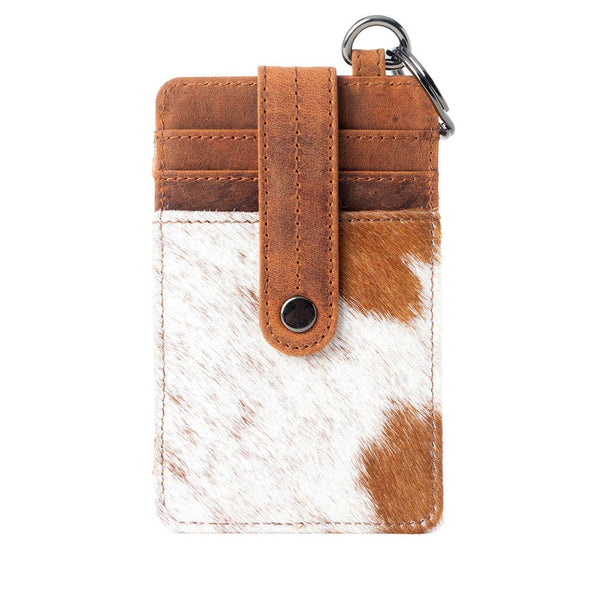 Brown and white cowhide phone card holder with leather strap on a white background