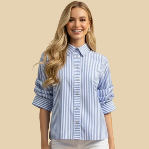 Woman wearing a blue and white striped shirt with rolled-up sleeves on a beige background