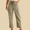 Person wearing green striped pants with a white background
