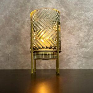 Decorative lamp with zigzag pattern on a textured wall background