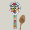 Decorative spoon with floral design on a white background