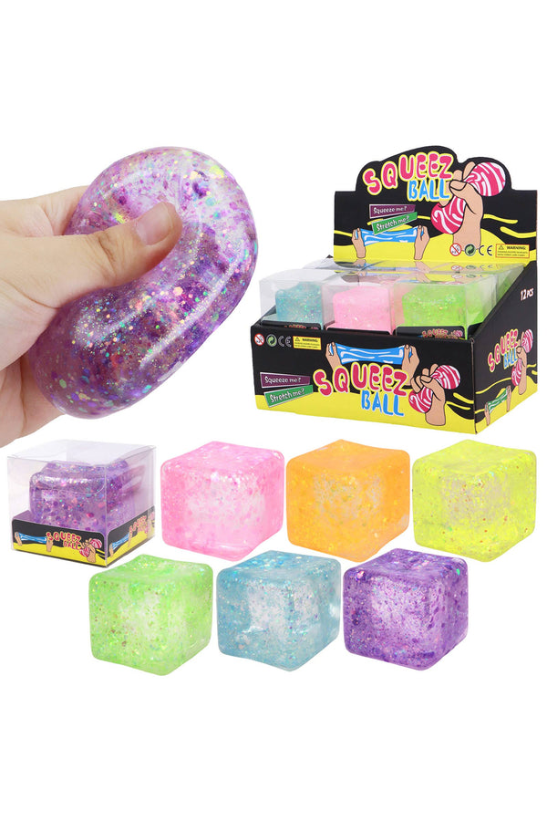 Colorful squishy balls with packaging on a white background