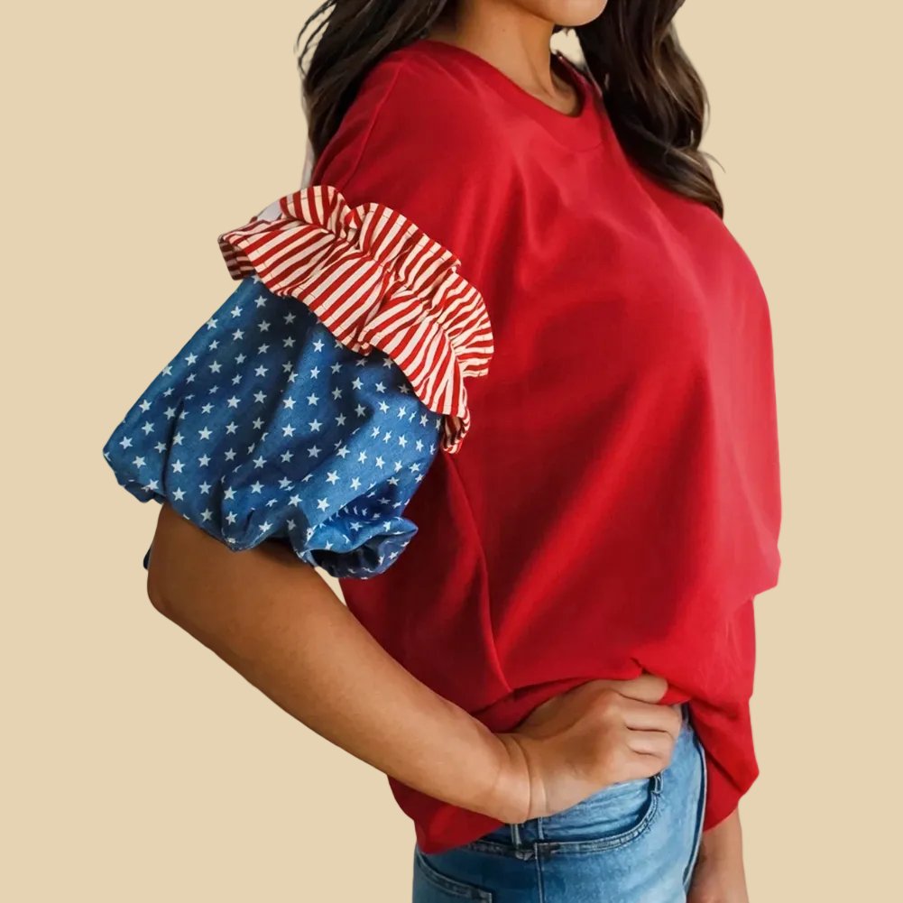 Red top with ruffled sleeves featuring blue and red patterns.