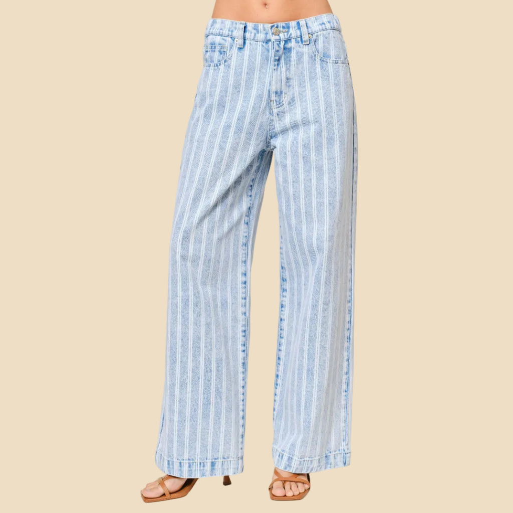 Striped blue and white pants on a neutral background