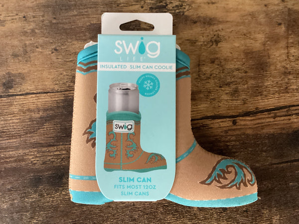 Cowboy boot-shaped can cooler with packaging on a wooden surface