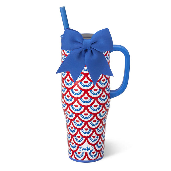 Tumbler with red and blue pattern and blue handle and straw on white background