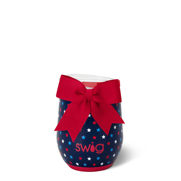 Blue Swig tumbler with red stars and a red bow on a white background