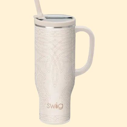 White textured mug with handle and straw on a white background