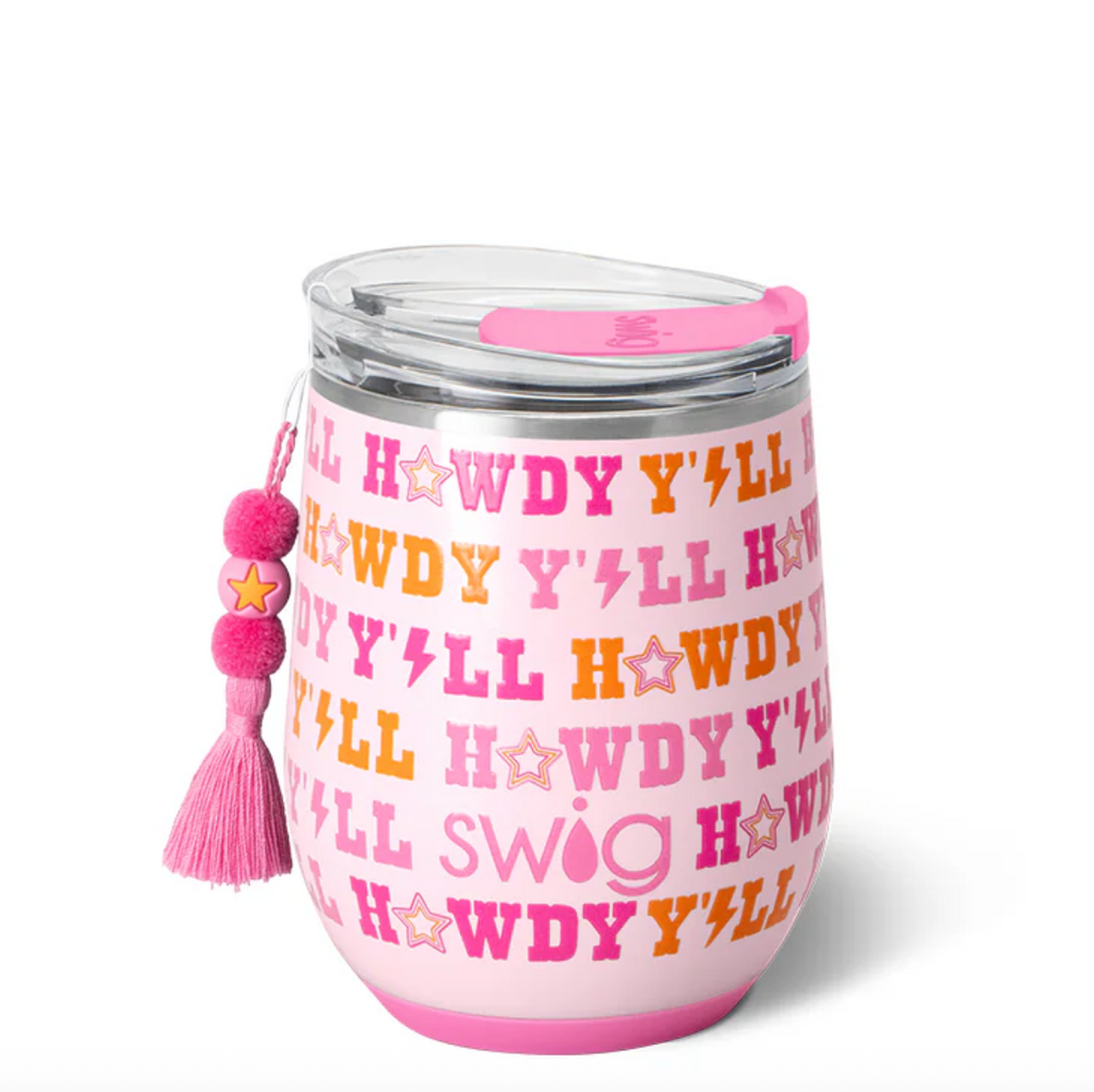Pink tumbler with text and a tassel on a white background
