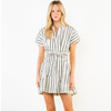Woman wearing a black and white striped dress on a white background