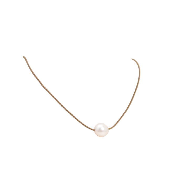 Simple pearl necklace on waxed thread against a white background