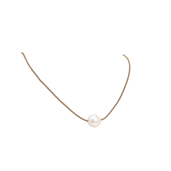 Simple pearl necklace on waxed thread against a white background