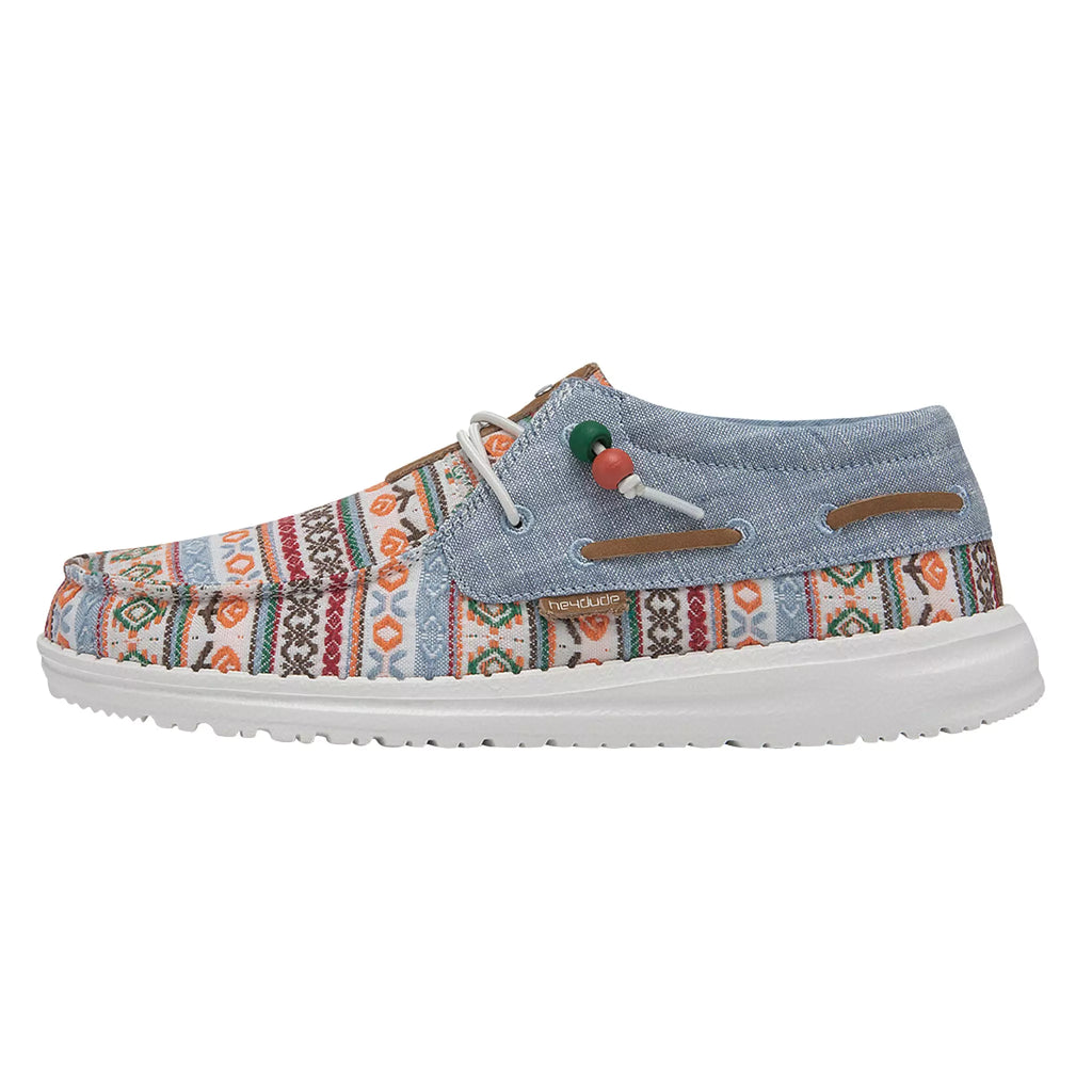 Multicolored patterned shoe with denim-like upper on a white background