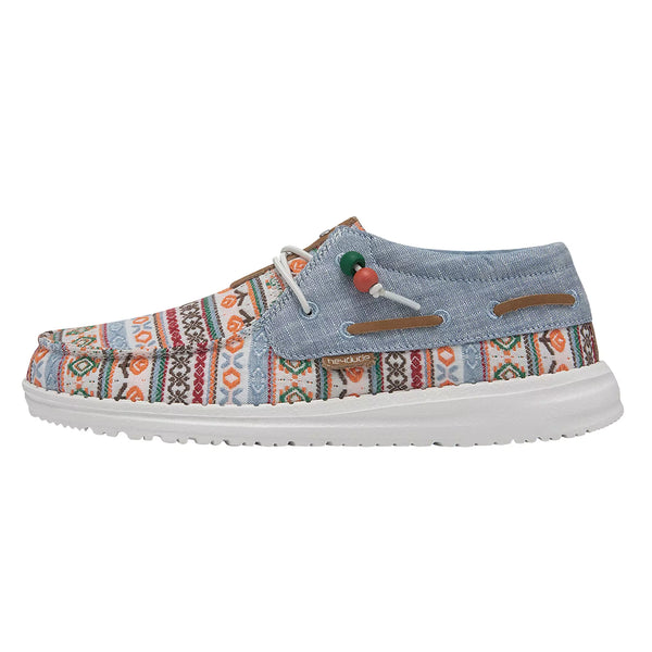 Multicolored patterned shoe with denim-like upper on a white background