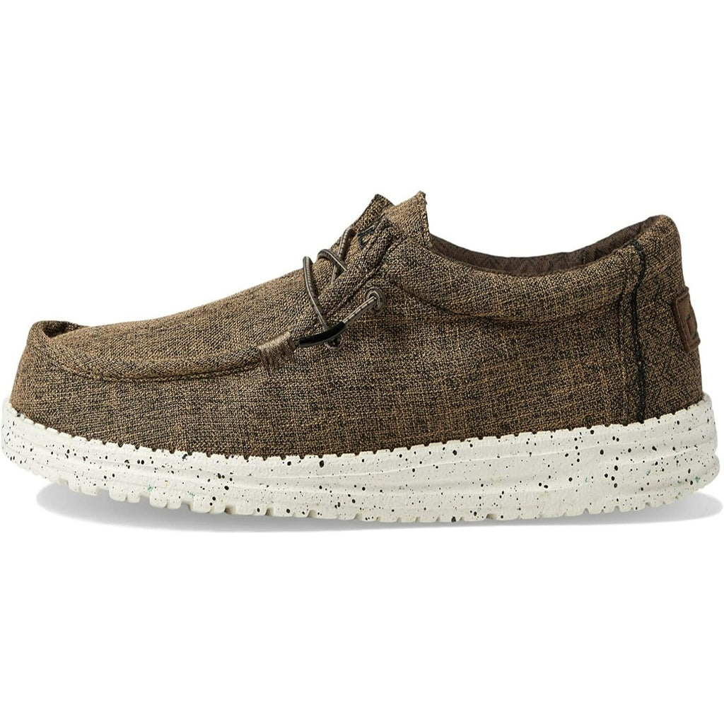 Brown shoe with white sole on a white background