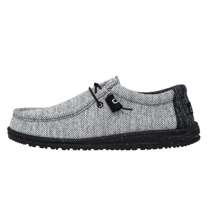 Gray casual shoe with black sole on a white background