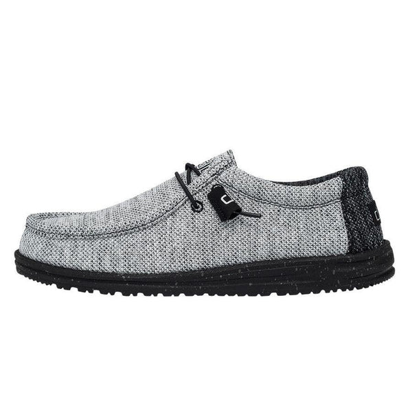 Gray casual shoe with black sole on a white background