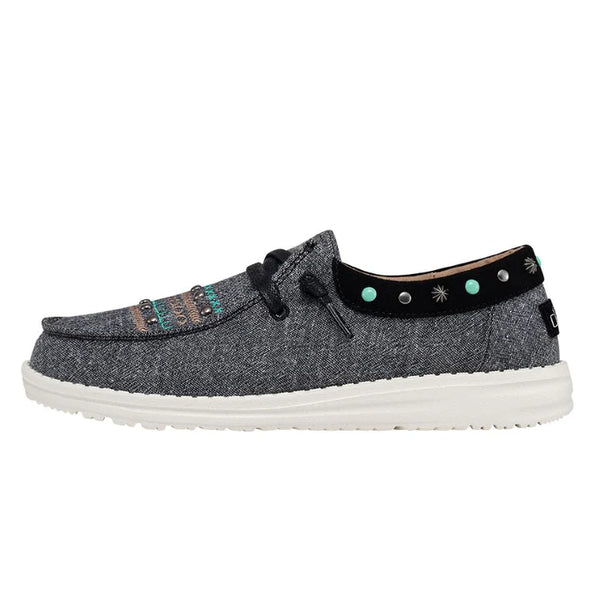 Gray shoe with decorative elements on a white background