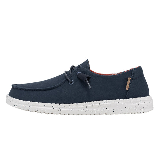 Navy blue shoe with white speckled sole on a white background
